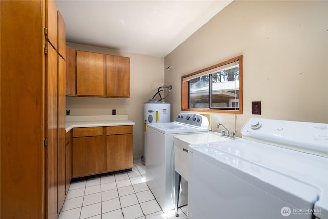 16757 Chilberg Ave, La Conner, WA 98257 - laundry room featuring cabinet space, washer and clothes dryer, water heater, and light tile patterned floors