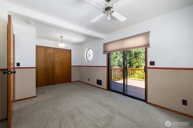 16757 Chilberg Ave, La Conner, WA 98257 - unfurnished bedroom with access to exterior, baseboards, carpet floors, a closet, and beamed ceiling