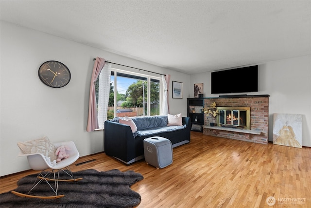 1350 S Woodlawn St, Tacoma, WA 98465 - living room with wood finished floors and a fireplace