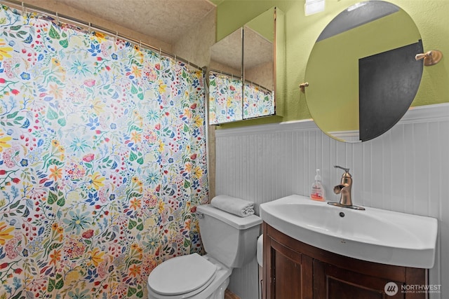 1350 S Woodlawn St, Tacoma, WA 98465 - bathroom with wainscoting, vanity, and a shower with curtain