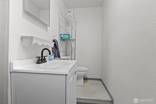 1350 S Woodlawn St, Tacoma, WA 98465 - bathroom with vanity and a textured wall