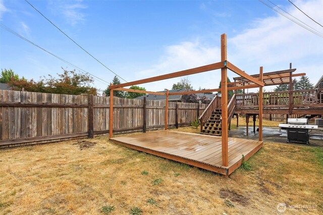 1350 S Woodlawn St, Tacoma, WA 98465 - wooden deck with a fenced backyard and stairway