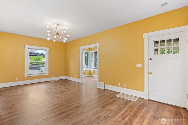 506 Douglas St, Wenatchee, WA 98801 - foyer entrance featuring a chandelier, wood finished floors, and baseboards