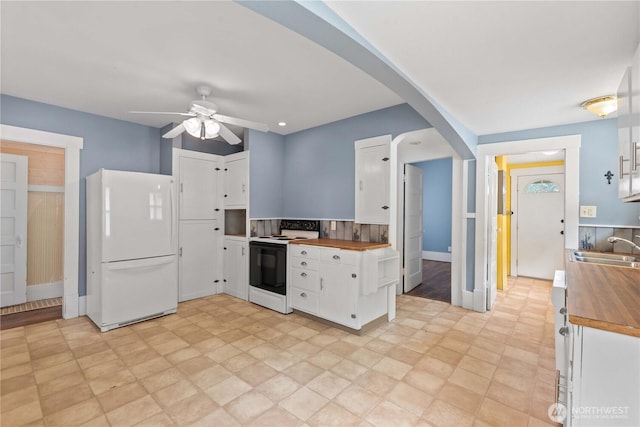506 Douglas St, Wenatchee, WA 98801 - kitchen featuring white appliances, wooden counters, ceiling fan, a sink, and arched walkways