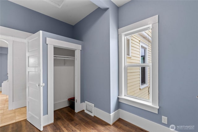 506 Douglas St, Wenatchee, WA 98801 - unfurnished bedroom with a closet, baseboards, and wood finished floors