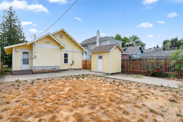 506 Douglas St, Wenatchee, WA 98801 - rear view of property featuring a fenced backyard and a patio area