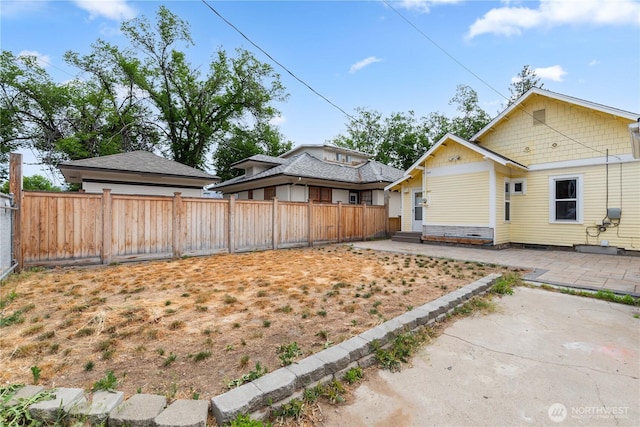 506 Douglas St, Wenatchee, WA 98801 - view of property exterior with a patio area and a fenced backyard