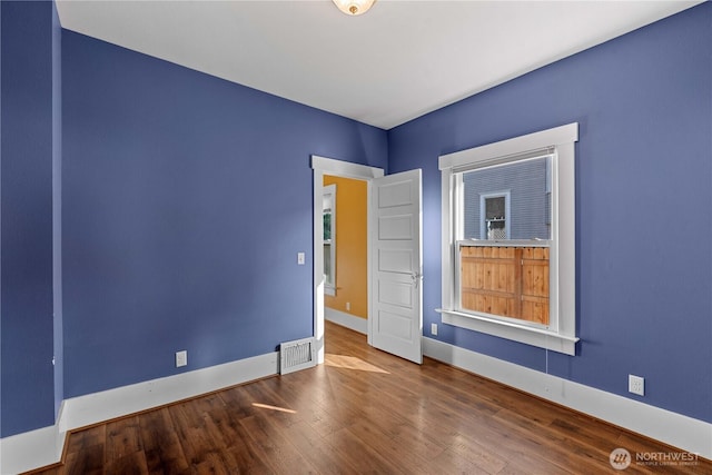 506 Douglas St, Wenatchee, WA 98801 - unfurnished room featuring wood finished floors and baseboards
