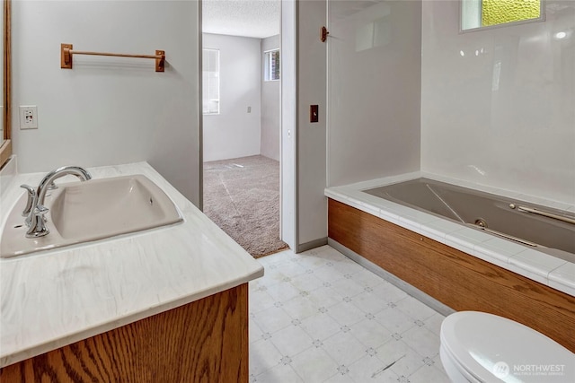17004 16th Ave SW, Normandy Park, WA 98166 - full bathroom with tile patterned floors, vanity, a tub with jets, and a textured ceiling