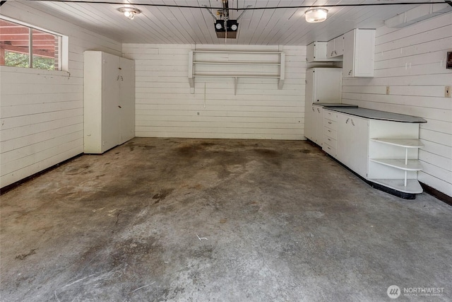 17004 16th Ave SW, Normandy Park, WA 98166 - garage with wood walls and a garage door opener