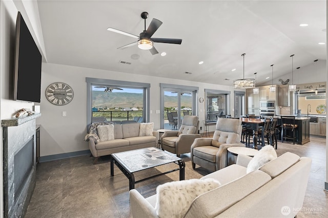 111 Wren Loop SW, Mattawa, WA 99349 - living room with lofted ceiling, a ceiling fan, a fireplace, and recessed lighting