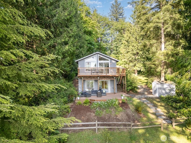 11009E Lake Joy Dr NE, Carnation, WA 98014 - rear view of house with a wooden deck and stairway