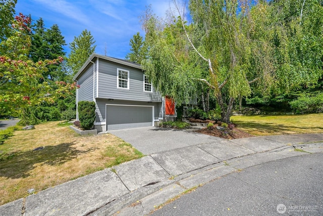 1999 Governor Rd, Bellingham, WA 98229 - raised ranch featuring a garage, driveway, and a front yard