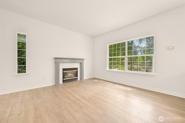 1999 Governor Rd, Bellingham, WA 98229 - unfurnished living room with wood finished floors and a fireplace