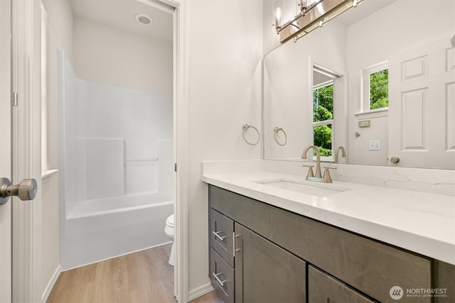 1999 Governor Rd, Bellingham, WA 98229 - full bathroom featuring vanity, wood finished floors, and tub / shower combination