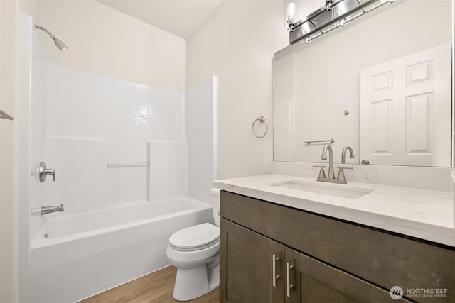 1999 Governor Rd, Bellingham, WA 98229 - full bathroom with vanity, wood finished floors, and  shower combination