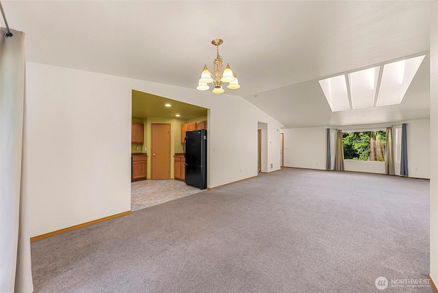 4441 Forgotten Ln, Clinton, WA 98236 - empty room with light carpet, a chandelier, lofted ceiling, a skylight, and recessed lighting