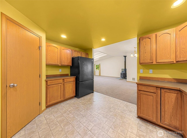 4441 Forgotten Ln, Clinton, WA 98236 - kitchen with freestanding refrigerator, a wood stove, light carpet, recessed lighting, and open floor plan