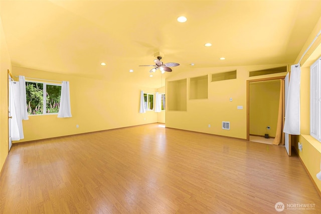 4441 Forgotten Ln, Clinton, WA 98236 - unfurnished room featuring healthy amount of natural light, light wood-type flooring, a ceiling fan, recessed lighting, and lofted ceiling