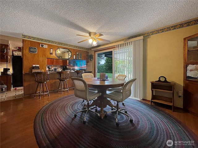 2208 Sandra Ave, Centralia, WA 98531 - dining area with a textured ceiling, wood finished floors, and ceiling fan