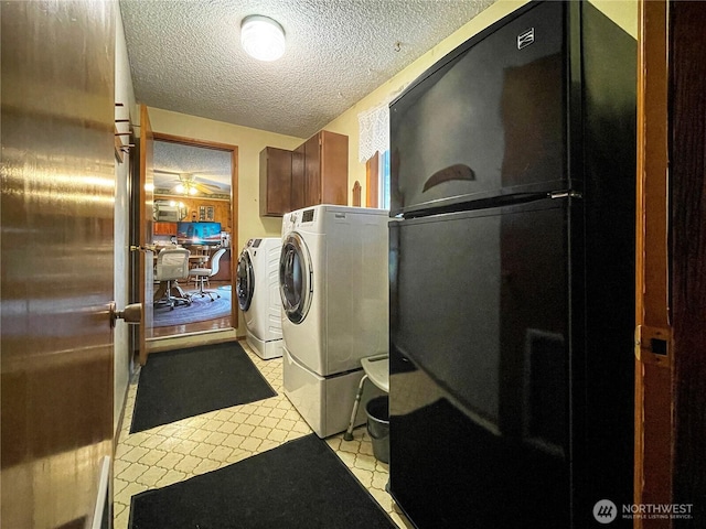 2208 Sandra Ave, Centralia, WA 98531 - laundry room featuring a textured ceiling, independent washer and dryer, cabinet space, and a ceiling fan