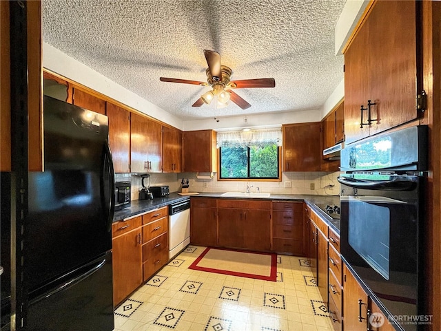 2208 Sandra Ave, Centralia, WA 98531 - kitchen featuring black appliances, a textured ceiling, a ceiling fan, dark countertops, and backsplash