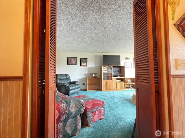2208 Sandra Ave, Centralia, WA 98531 - carpeted bedroom featuring a textured ceiling, a wainscoted wall, and wooden walls