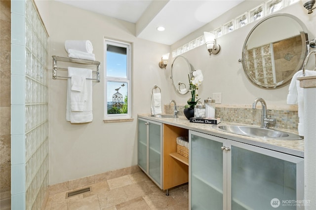 13712 SE 44th St, Bellevue, WA 98006 - full bathroom with double vanity, baseboards, tasteful backsplash, recessed lighting, and stone finish floors