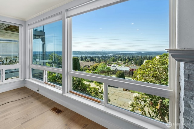 13712 SE 44th St, Bellevue, WA 98006 - unfurnished sunroom with crown molding, wood finished floors, and plenty of natural light