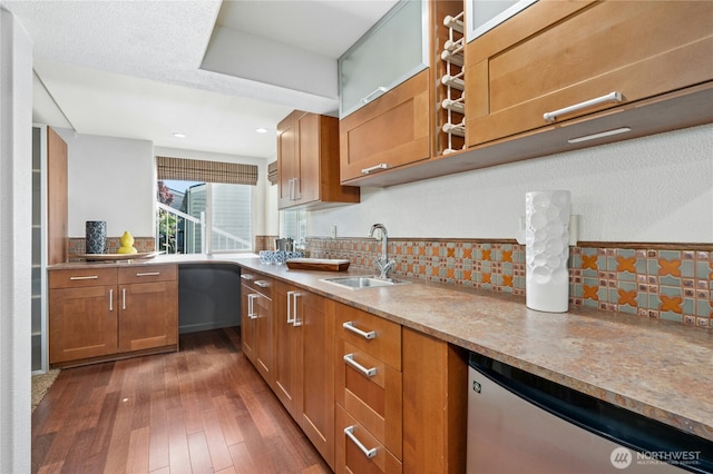 13712 SE 44th St, Bellevue, WA 98006 - kitchen with a sink, stainless steel dishwasher, tasteful backsplash, dark wood-style flooring, and brown cabinetry