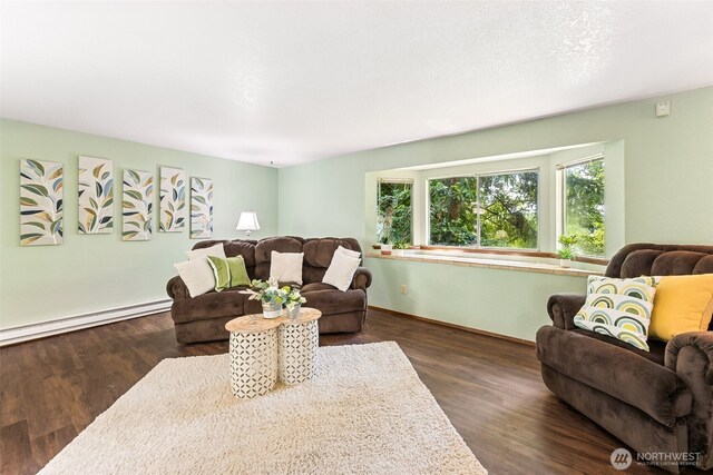10320 46th Ave SE, Olympia, WA 98513 - living area featuring a baseboard radiator and wood finished floors