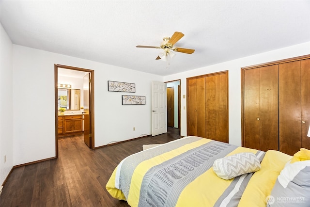 10320 46th Ave SE, Olympia, WA 98513 - bedroom with dark wood-style floors, two closets, ensuite bathroom, and a ceiling fan