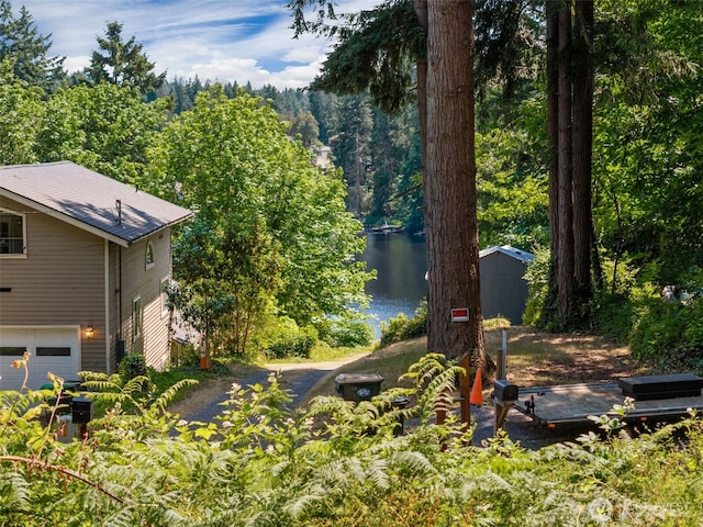 10320 46th Ave SE, Olympia, WA 98513 - view of yard with a water view and an attached garage