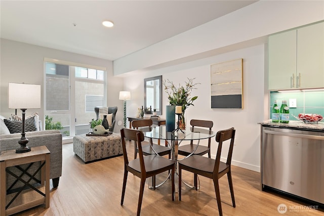 1085 103rd Ave NE Unit 203, Bellevue, WA 98004 - dining space with light wood-style flooring, baseboards, and recessed lighting