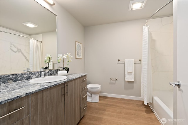 1085 103rd Ave NE Unit 203, Bellevue, WA 98004 - full bathroom with vanity, toilet, wood finished floors, baseboards, and shower / bathtub combination with curtain