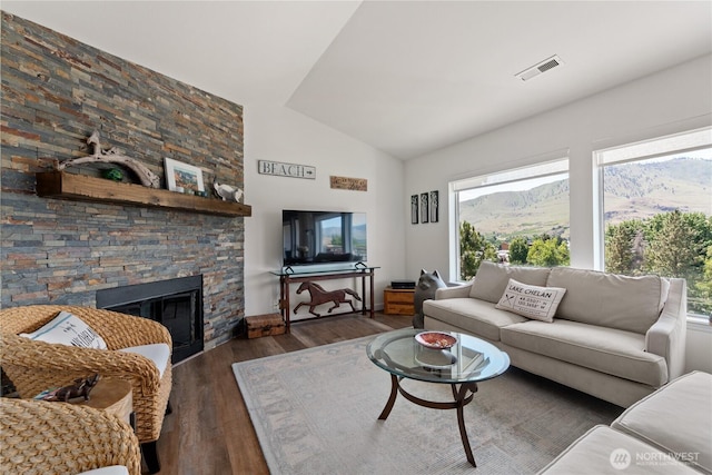 808 W Manson Rd Unit B303, Chelan, WA 98816 - living room with wood finished floors, a stone fireplace, and high vaulted ceiling