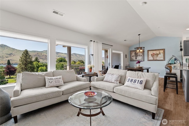 808 W Manson Rd Unit B303, Chelan, WA 98816 - living room featuring lofted ceiling, wood finished floors, and a mountain view