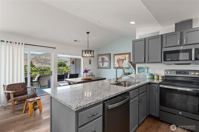 808 W Manson Rd Unit B303, Chelan, WA 98816 - kitchen featuring stainless steel appliances, gray cabinets, a peninsula, lofted ceiling, and a sink