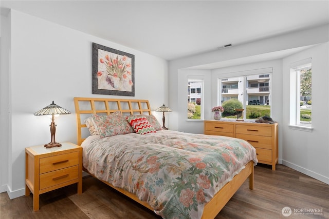 808 W Manson Rd Unit B303, Chelan, WA 98816 - bedroom with multiple windows, wood finished floors, and baseboards