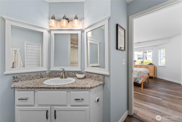 808 W Manson Rd Unit B303, Chelan, WA 98816 - full bath with vanity, baseboards, wood finished floors, and ensuite bathroom