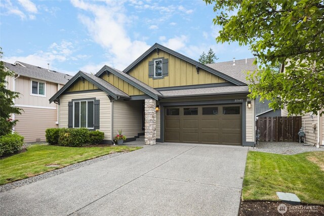 35681 30th Ave S, Federal Way, WA 98003 - craftsman-style house featuring board and batten siding, driveway, a garage, and a shingled roof