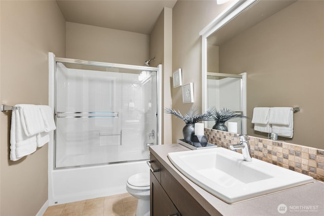 35681 30th Ave S, Federal Way, WA 98003 - full bath with vanity, toilet, combined bath / shower with glass door, tile patterned flooring, and tasteful backsplash
