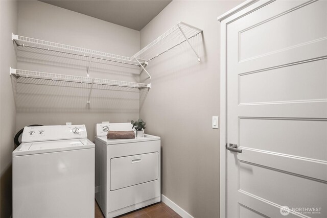 35681 30th Ave S, Federal Way, WA 98003 - washroom featuring washer and dryer, baseboards, and dark tile patterned floors