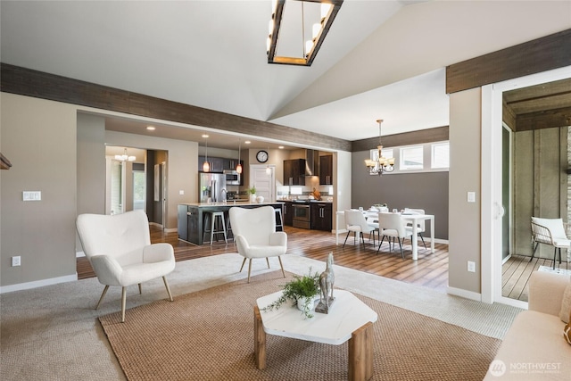 35681 30th Ave S, Federal Way, WA 98003 - living room with a chandelier, light carpet, vaulted ceiling, baseboards, and recessed lighting