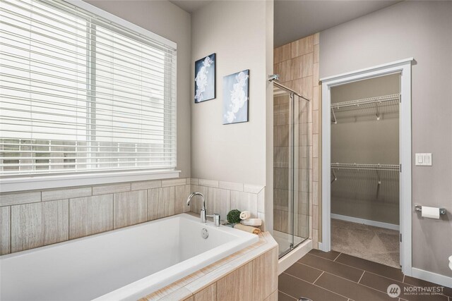 35681 30th Ave S, Federal Way, WA 98003 - full bathroom featuring a stall shower, a bath, a spacious closet, tile patterned floors, and plenty of natural light