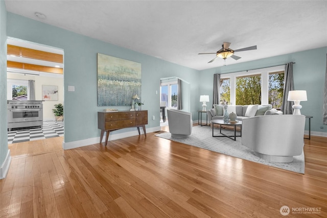 1814 SW 347th Pl, Federal Way, WA 98023 - living room with a ceiling fan, hardwood / wood-style flooring, baseboards, and arched walkways