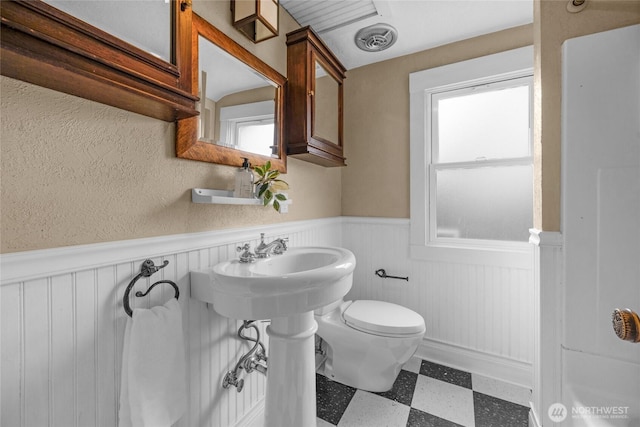 1814 SW 347th Pl, Federal Way, WA 98023 - bathroom featuring wainscoting, tile patterned floors, and toilet