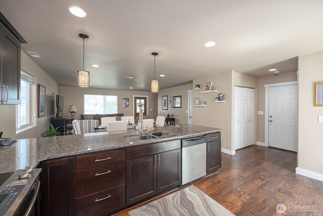1300 W Marina Dr Unit 1, Moses Lake, WA 98837 - kitchen with dishwasher, a sink, dark wood finished floors, dark brown cabinets, and hanging light fixtures
