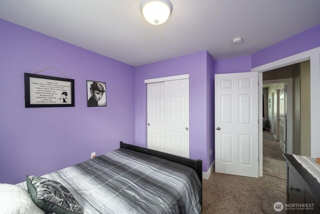 1300 W Marina Dr Unit 1, Moses Lake, WA 98837 - bedroom featuring dark carpet, a closet, and baseboards