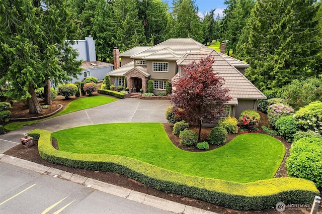 2805 Sahalee Dr E, Sammamish, WA 98074 - view of front of house featuring a chimney, a tiled roof, and a front yard